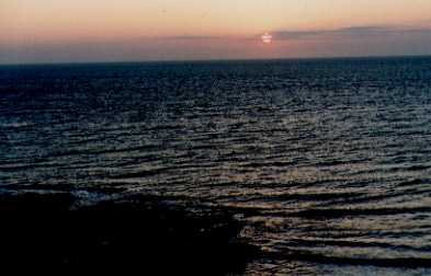 This is a photograph of the Spring Equinox   sunset taken at Church Bay, Ynys M?n, North wales.