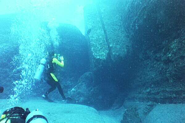 an image of Dr Robert M. Schoch photographing the underwater structure at Yonaguni Jima