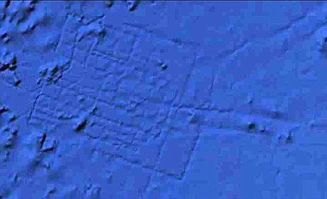 An image of the underwater grid system etched onto the ocean bed about 620 miles off the west coast of Africa as found by Google Ocean, which is also a clickable link to the Daily Mail story
