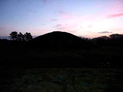 A photograph of Bryn Celli Ddu at first light on the Alban Eilir - the Vernal Equinox 2002