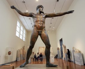 An image of the 5th Century bronze statue of Poseidon now stands in Greece's National Archaeological Museum after being salvaged from the sea, which is also a clickable link to a higher resolution image