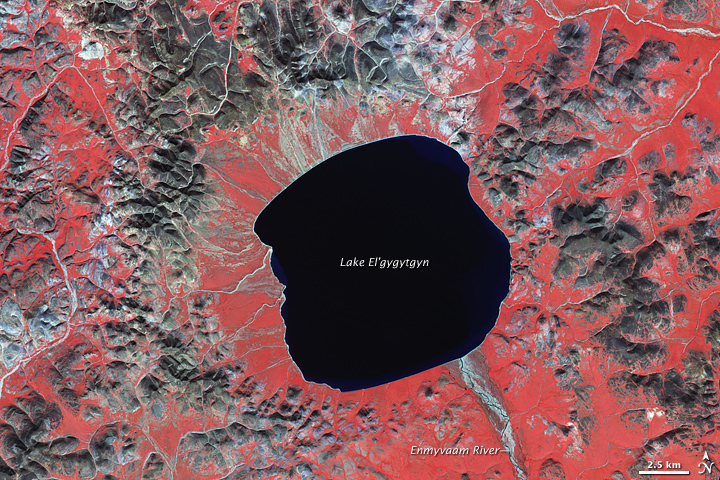an image/link of The El'gygytgyn Crater in the Russian Far East as seen by the Earth Observatory in Earth orbit from the NASA Earth Observatory website where more information on this crater is available if you click the image