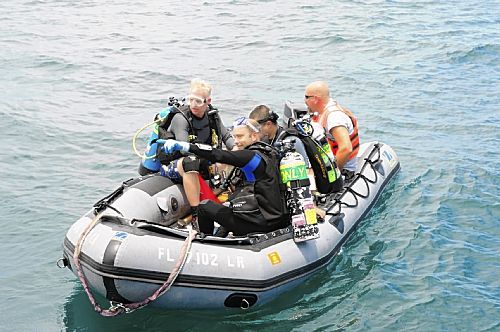 an image showing researchers from Mercyhurst Archaeological Institute heading for a dive site, which is also a clickable link direct to the Post-Gazette, USA story
