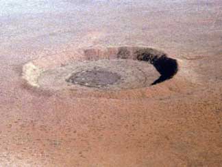 an image of the impact crater at Wolfe Creek, Australia, it is also a link to the National Parks website where more information on this crater is available if you click the image